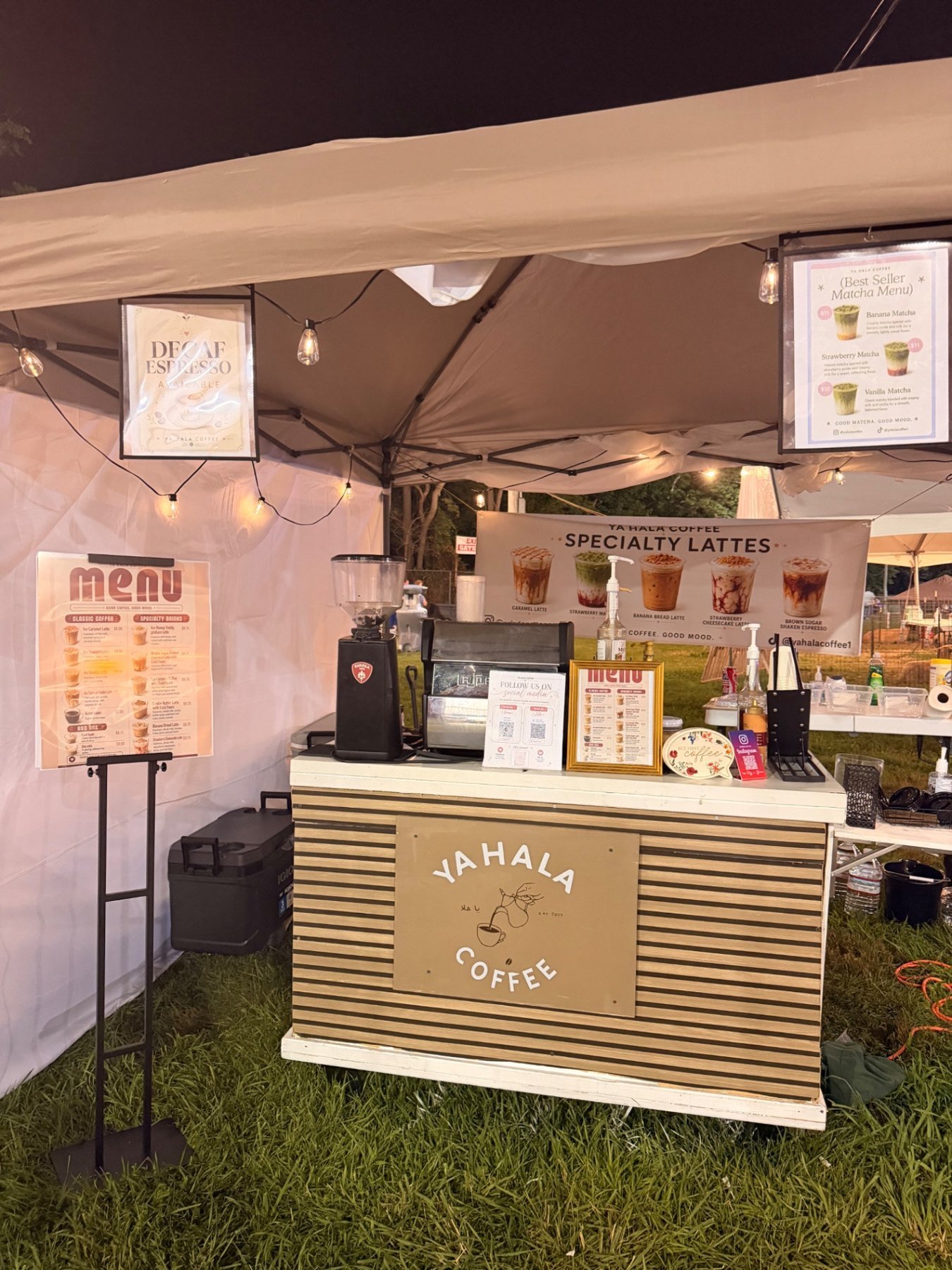 The Ya Hala Coffee cart set up on a lawn in front of historic buildings